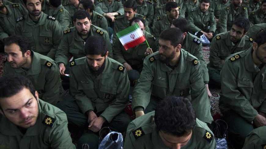 EDITORS' NOTE: Reuters and other foreign media are subject to Iranian restrictions on leaving the office to report, film or take pictures in Tehran.

Members of the revolutionary guard attend the anniversary ceremony of Iran's Islamic Revolution at the Khomeini shrine in the Behesht Zahra cemetery, south of Tehran, February 1, 2012. REUTERS/Raheb Homavandi  (IRAN - Tags: POLITICS ANNIVERSARY MILITARY) - RTR2X5DT