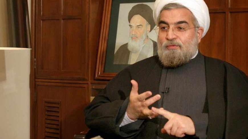 Iran's chief nuclear negotiator Hassan Rohani speaks with a Reuters correspondent during a private interview in Tehran February 6, 2005. REUTERS/Raheb Homavandi  RH/CJF/AA - RTRMHK5
