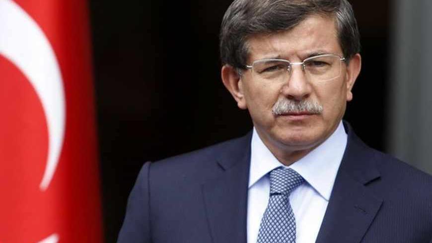 Turkey's Foreign Minister Ahmet Davutoglu addresses the media in Ankara June 13, 2013. REUTERS/Umit Bektas (TURKEY - Tags: POLITICS) - RTX10M6J