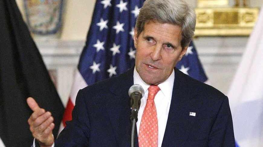 U.S. Secretary of State John Kerry announces further peace talks at a news conference with Israel's Justice Minister Tzipi Livni (L) and Chief Palestinian negotiator Saeb Erekat (R) at the State Department in Washington July 30, 2013. Israel and the Palestinians will seek to reach a peace agreement within nine months and negotiators will meet again within two weeks after holding a "positive" first round of talks, Kerry said on Tuesday. REUTERS/Jonathan Ernst (UNITED STATES - Tags: POLITICS) - RTX1250G