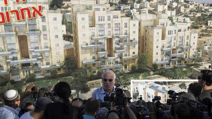 Israeli Housing Minister Uri Ariel speaks to reporters at a ceremony announcing the resumption of construction of an Israeli neighbourhood in East Jerusalem August 11, 2013. Israel moved forward on Sunday with plans to build nearly 1,200 new homes for Jewish settlers holding fast to a defiant settlement policy just days before its expected release of Palestinian prisoners. REUTERS/Ronen Zvulun (JERUSALEM - Tags: POLITICS) - RTX12HFR