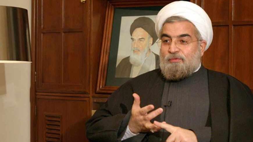 Iran's chief nuclear negotiator Hassan Rohani speaks with a Reuters correspondent during a private interview in Tehran February 6, 2005. REUTERS/Raheb Homavandi  RH/CJF/AA - RTRMHK5