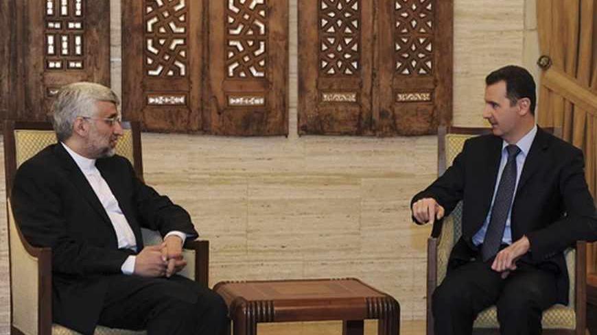 Syria's President Bashar al-Assad (R) meets Iran's Supreme National Security Council Secretary Saeed Jalili in Damascus February 3, 2013, in this handout photograph released by Syria's national news agency SANA. REUTERS/Sana (SYRIA - Tags: CIVIL UNREST POLITICS)

ATTENTION EDITORS - THIS IMAGE WAS PROVIDED BY A THIRD PARTY. FOR  EDITORIAL USE ONLY. NOT FOR SALE FOR MARKETING OR ADVERTISING CAMPAIGNS. THIS PICTURE IS DISTRIBUTED EXACTLY AS RECEIVED BY REUTERS, AS A SERVICE TO CLIENTS - RTR3DAL6