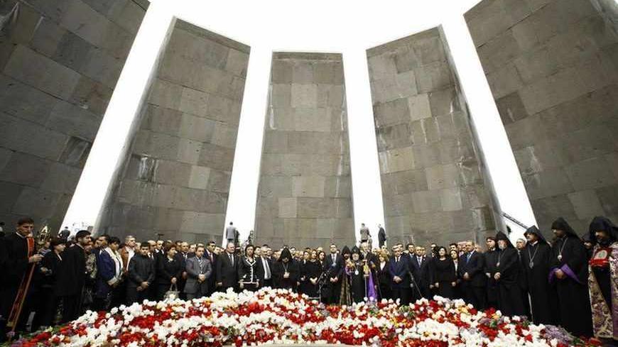 People take part in a commemoration ceremony to mark the anniversary of the 1915 mass killings of Armenians in the Ottoman Empire at the Armenian Genocide Memorial in Yerevan, April 24, 2011. Armenia, backed by many historians and world parliaments, says some 1.5 million Armenians died during the upheavals that accompanied World War I and labels the events as genocide. On the other hand, Ankara rejects the term genocide and says large numbers of both Christian Armenians and Muslim Turks were killed. REUTE