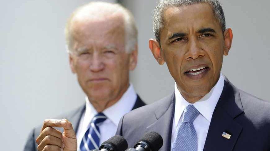 U.S. President Barack Obama speaks about Syria next to Vice President Joe Biden (L) at the Rose Garden of the White House August 31, 2013, in Washington. Obama said on Saturday he had decided the United States should strike Syrian government targets in response to a deadly chemical weapons attack, but said he would seek a congressional vote for any military action.        REUTERS/Mike Theiler (UNITED STATES - Tags: POLITICS) - RTX132W2
