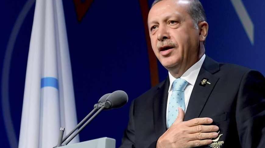 Turkish Prime Minister Tayyip Erdogan speaks during
the presentation by the Istanbul 2020 committee as a candidate to host the 2020 Summer Olympic Games, in Buenos Aires September 7, 2013. The IOC will elect the winning city from candidates Istanbul, Madrid, and Tokyo on Saturday afternoon at their 125th Session in the Argentine capital. REUTERS/Fabrice Coffrini/Pool (ARGENTINA - Tags: SPORT OLYMPICS) - RTX13BCO