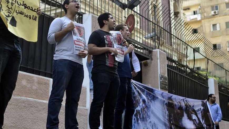 Egyptian activists and pro-government protester demonstrate outside the Turkish embassy in Cairo on August 24, 2013, against Turkish Prime Minister Recep Tayyip Erdogan. Erdogan criticised Washington for its response to his claims of Israel's involvement in the Egypt crisis. AFP PHOTO/MOHAMED EL SHAHED        (Photo credit should read MOHAMED EL-SHAHED/AFP/Getty Images)