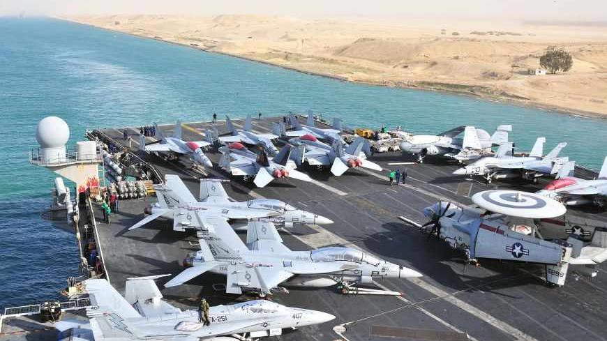 The aircraft carrier USS Enterprise transits the Suez Canal in Egypt in this February 15, 2011 handout photo provided by the U.S. Navy. The United States is moving warships and aircraft, including the USS Enterprise, into the Mediterranean Sea near Libya, according to U.S. officials. REUTERS/U.S. Navy/Mass Communication Specialist Seaman Jesse L. Gonzalez/Handout (EGYPT - Tags: MILITARY POLITICS) FOR EDITORIAL USE ONLY. NOT FOR SALE FOR MARKETING OR ADVERTISING CAMPAIGNS. THIS IMAGE HAS BEEN SUPPLIED BY A T