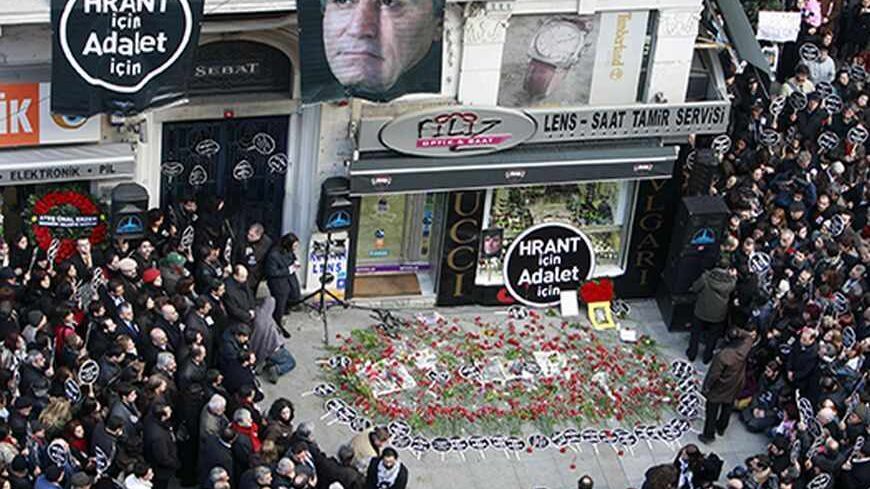 Protesters gather in front of the office of the Agos newspaper during a demonstration in Istanbul January 19, 2009, to mark the second anniversary of the killing of Turkish Armenian editor Hrant Dink. REUTERS/Osman Orsal (TURKEY) - RTR23LJK