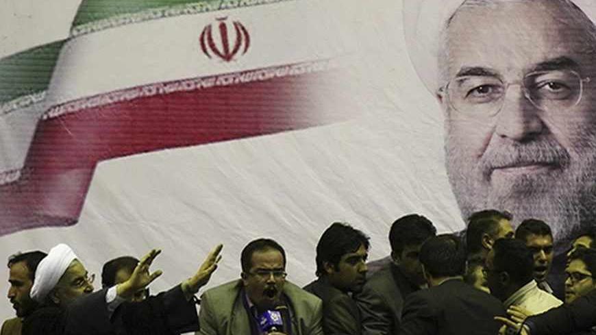 Iranian presidential candidate Hassan Rohani (L) waves to supporters in the central Iranian city of Shiraz June 11, 2013. Picture taken June 11, 2013. REUTERS/Fars News/Mohammad Hadi Khosravi (IRAN - Tags: POLITICS ELECTIONS) ATTENTION EDITORS - THIS IMAGE WAS PROVIDED BY A THIRD PARTY. FOR EDITORIAL USE ONLY. NOT FOR SALE FOR MARKETING OR ADVERTISING CAMPAIGNS. THIS PICTURE IS DISTRIBUTED EXACTLY AS RECEIVED BY REUTERS, AS A SERVICE TO CLIENTS - RTX10L22