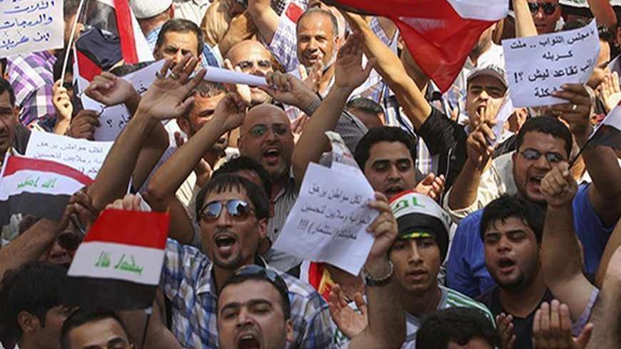 Protesters demand that the pensions of parliamentarians be cancelled during a demonstration in Kerbala, 110 km (68 miles) south of Baghdad, August 31, 2013. Hundreds of protesters took to the streets in Baghdad and central and southern Iraq on Saturday against generous pension payments to lawmakers in a county where many are still struggling to get jobs and basic services. REUTERS/Mushtaq Muhammed (IRAQ - Tags - Tags: POLITICS BUSINESS EMPLOYMENT SOCIETY CIVIL UNREST) - RTX132KM