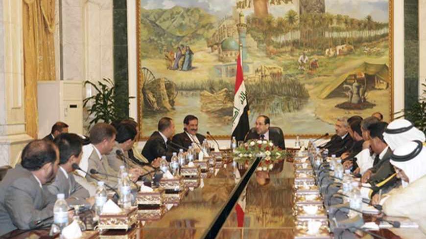 Iraq's Prime Minister Nuri al-Maliki (C) meets tribe leaders and officials of Salahuddin province, in Baghdad June 27, 2009. 
REUTERS/Iraqi Government /Handout (IRAQ CONFLICT POLITICS) FOR EDITORIAL USE ONLY. NOT FOR SALE FOR MARKETING OR ADVERTISING CAMPAIGNS - RTR253H6