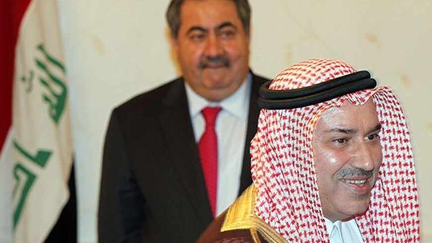 Iraq's Foreign Minister Hoshiyar Zebari (back) receives the newly appointed ambassador of Saudi Arabia to Iraq, Mohanned Sleman al-Zaid, at the headquarters of the Foreign Ministry in Baghdad March 26, 2012. REUTERS/Mohammed Ameen (IRAQ - Tags: POLITICS) - RTR2ZWZ0