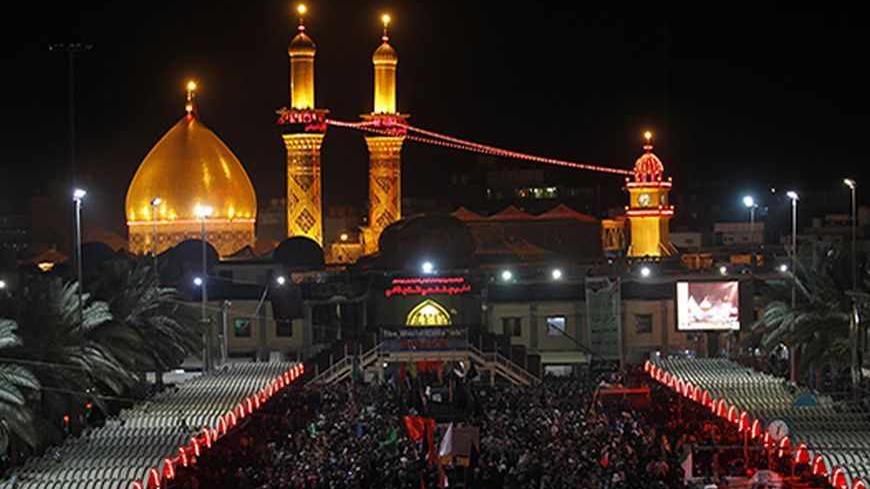 Shi'ite Muslim pilgrims take part in a ceremony to mark the religious ritual of Arbain in Kerbala, about 80 km (50 miles) southwest of Baghdad, January 2, 2013. REUTERS/Mohammed Ameen (IRAQ - Tags: POLITICS) - RTR3C22O