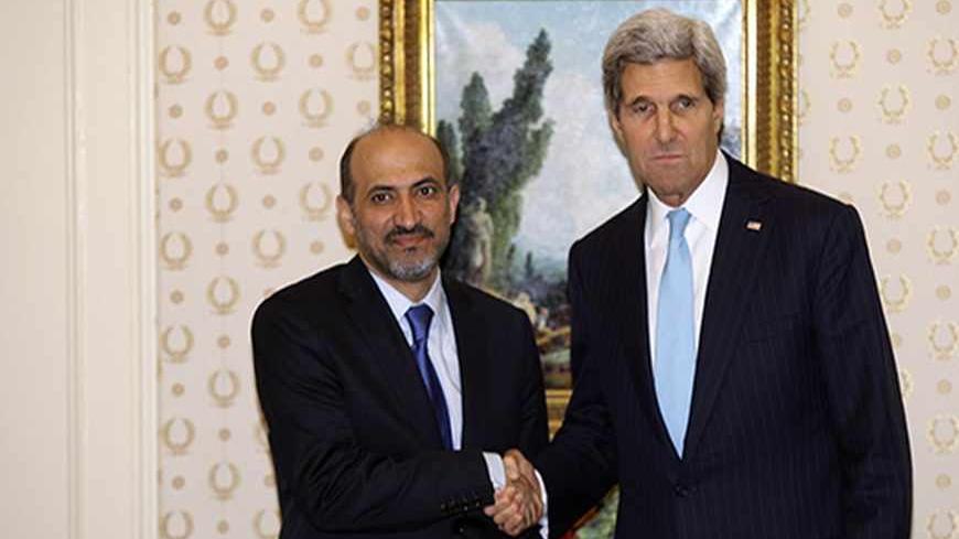 Secretary of State John Kerry shakes hands with Syrian Opposition Coalition Chairman Ahmed Assi al-Jarba during the United Nations General Assembly at the Waldorf Astoria in New York September 24, 2013. REUTERS/Joshua Lott (UNITED STATES - Tags: POLITICS) - RTX13YF3