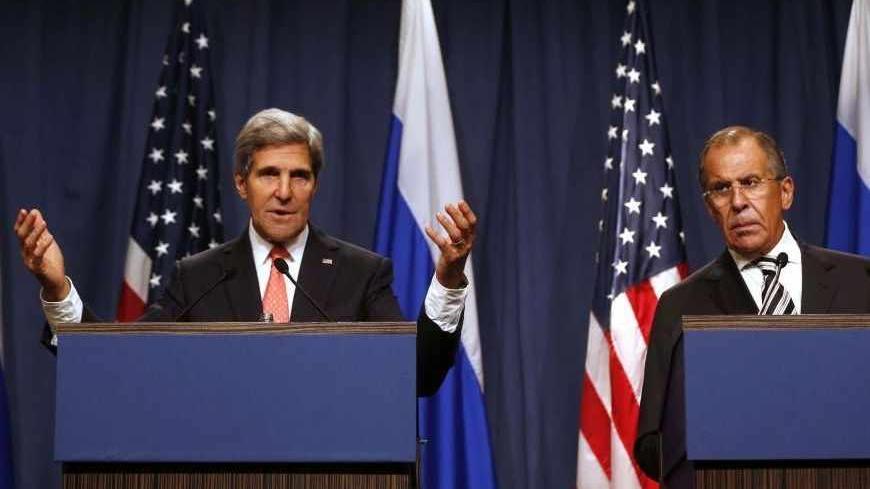U.S. Secretary of State John Kerry (L) speaks next to Russian Foreign Minister Sergei Lavrov as they answer questions from the media, following meetings regarding Syria, at a news conference in Geneva September 14, 2013. The United States and Russia have agreed on a proposal to eliminate Syria's chemical weapons arsenal, Kerry said on Saturday after nearly three days of talks with Lavrov.  REUTERS/Larry Downing  (SWITZERLAND - Tags: POLITICS CIVIL UNREST) - RTX13KRV