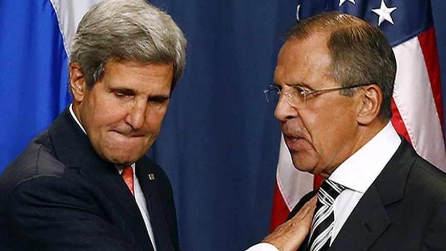U.S. Secretary of State John Kerry (L) and Russian Foreign Minister Sergei Lavrov shake hands after making statements following meetings regarding Syria, at a news conference in Geneva September 14, 2013. The United States and Russia have agreed on a proposal to eliminate Syria's chemical weapons arsenal, Kerry said on Saturday after nearly three days of talks with Lavrov. REUTERS/Ruben Sprich (SWITZERLAND - Tags: POLITICS) - RTX13KX7