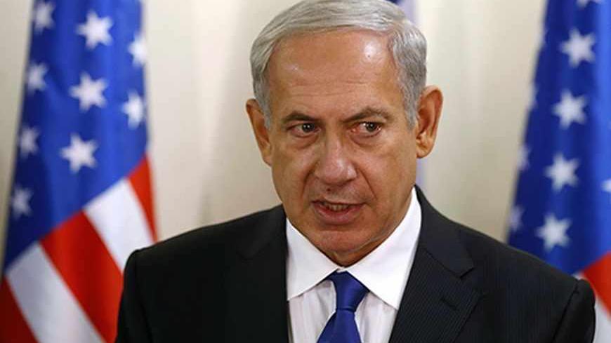 Israel's Prime Minister Benjamin Netanyahu speaks to the media after a meeting with U.S. Secretary of State John Kerry at the prime minister's office in Jerusalem September 15, 2013. Kerry briefed Netanyahu on Sunday on a U.S.-Russian deal to remove Syria's chemical weapons, an accord that drew a guarded response from the Israeli leader.   REUTERS/Larry Downing (JERUSALEM - Tags: POLITICS CIVIL UNREST) - RTX13M58