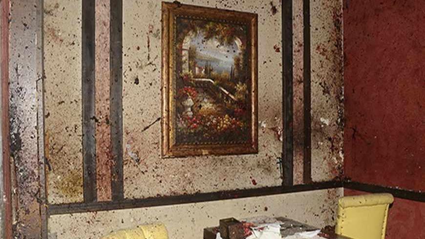 ATTENTION EDITORS - VISUAL COVERAGE OF SCENES OF INJURY OR DEATH
Blood covers the walls and furniture of a restaurant after a suicide bombing, at al-Basel Sport city in Aleppo, August 22, 2013. A suicide bomber wearing an explosive belt blew himself up in the crowded restaurant during a private party, killing at least seven people according to Syria's national news agency SANA. Picture taken August 22, 2013. REUTERS/George Ourfalian (SYRIA - Tags: POLITICS CIVIL UNREST CONFLICT BUSINESS) TEMPLATE OUT - RTX1
