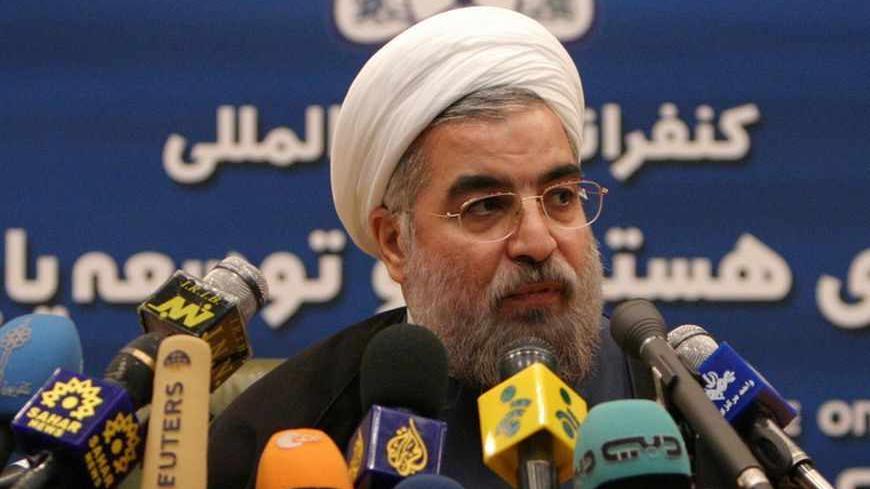 Secretary of Iran's Supreme National Security Council and Iran's chief nuclear negotiator Hassan Rohani speaks to the media after the International Conference on Nuclear Technology and Sustainable Development in Tehran March 5, 2005. Iran warned on Saturday it would return to making nuclear fuel and that the Middle East would get more unstable if the Islamic Republic was sent to the U.N. Security Council over its atomic programme. REUTERS/Raheb Homavandi MN/AT - RTR40GY