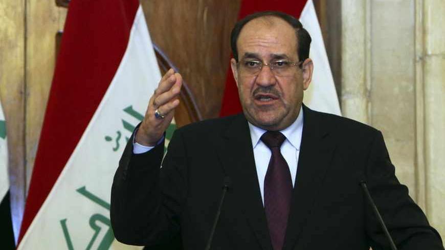 Iraqi Prime Minister Nuri al-Maliki (R) and Iraqi Kurdish President Masoud Barzani (L) hold a joint news conference in Baghdad, July 7, 2013. Barzani visited Baghdad on Sunday for the first time in more than two years, in a symbolic step to resolve disputes between the central government and the autonomous region over land and oil. The visit follows an equally rare trip by Iraqi Prime Minister Nuri al-Maliki who met Barzani in Kurdistan last month, breaking ice between leaders who have repeatedly accused ea