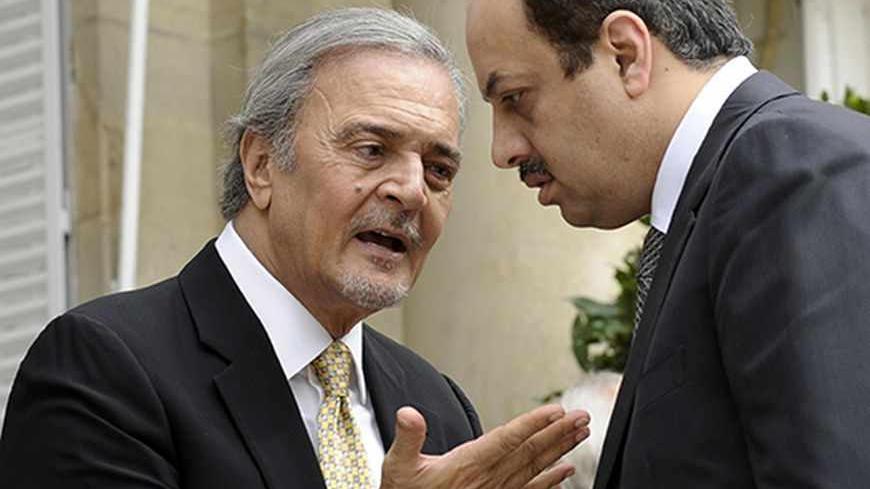 Saudi Foreign Minister Saud al Faisal (L) talks with Qatar Foreign Minister Khalid Al Attiya following their meeting with U.S. Secretary of State John Kerry and members of the Arab Peace Initiative at the United States Embassy in Paris, September 8, 2013. REUTERS/Susan Walsh/Pool (FRANCE - Tags: POLITICS) - RTX13CWG