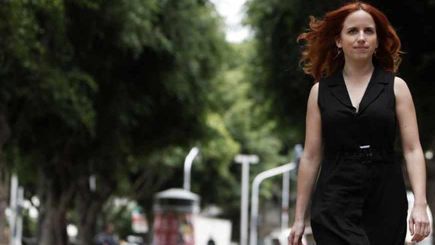 Labour party candidate Stav Shaffir poses on Rothschild Avenue in Tel Aviv, the site of a 2011 protest against high housing costs, December 5, 2012. The leaders of a grassroots social protest movement that swept Israel in 2011, one of them Shaffir, have shot to the top of a rejuvenated Labour party that polls say will at least double its power in a Jan. 22 general election that Prime Minister Benjamin Netanyahu's right-wing Likud is forecast to win. Picture taken December 5, 2012.  REUTERS/Amir Cohen (ISRAE