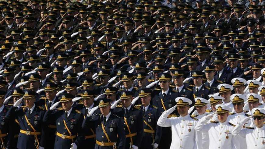 Turkish soldiers salute during a ceremony marking the 91st anniversary of Victory Day at the mausoleum of Mustafa Kemal Ataturk, founder of modern Turkey, in Ankara August 30, 2013. REUTERS/Umit Bektas (TURKEY - Tags: POLITICS MILITARY) - RTX131DP