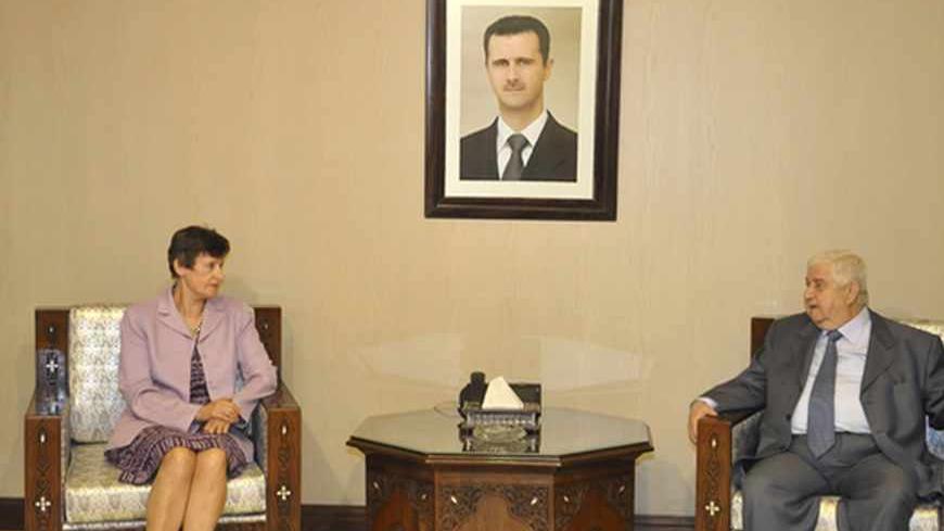 Syrian Foreign Minister Walid al-Muallem (R) meets U.N. High Representative for Disarmament Affairs Angela Kane in Damascus, in this handout photo distributed by Syria's national news agency SANA on August 25, 2013. Syria has agreed to allow U.N. inspectors access to sites in suburbs of Damascus where alleged chemical attacks occurred, the Syria Foreign Ministry said in a statement broadcast on state television. REUTERS/SANA/Handout via Reuters (SYRIA - Tags: POLITICS CONFLICT CIVIL UNREST) 
ATTENTION EDITO