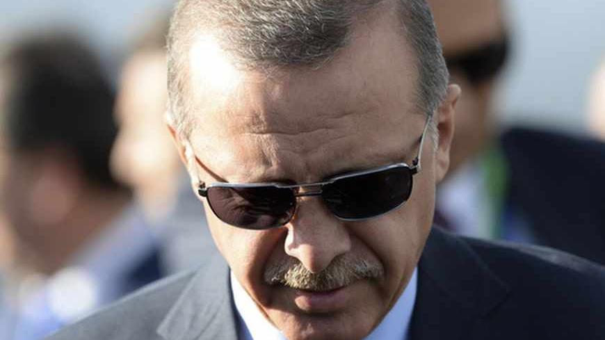 Turkish Prime Minister Tayyip Erdogan gets into a car upon his arrival a day before the G20 Summit in St. Petersburg, September 4, 2013. The Group of 20 cut its teeth in the global financial crisis of 2009, achieving unprecedented cooperation between developed and emerging nations to stave off economic collapse which has not been matched since. REUTERS/Alexei Maishev/RIA Novosti/Pool (RUSSIA - Tags: POLITICS BUSINESS HEADSHOT) ATTENTION EDITORS - THIS IMAGE HAS BEEN SUPPLIED BY A THIRD PARTY. IT IS DISTRIBU