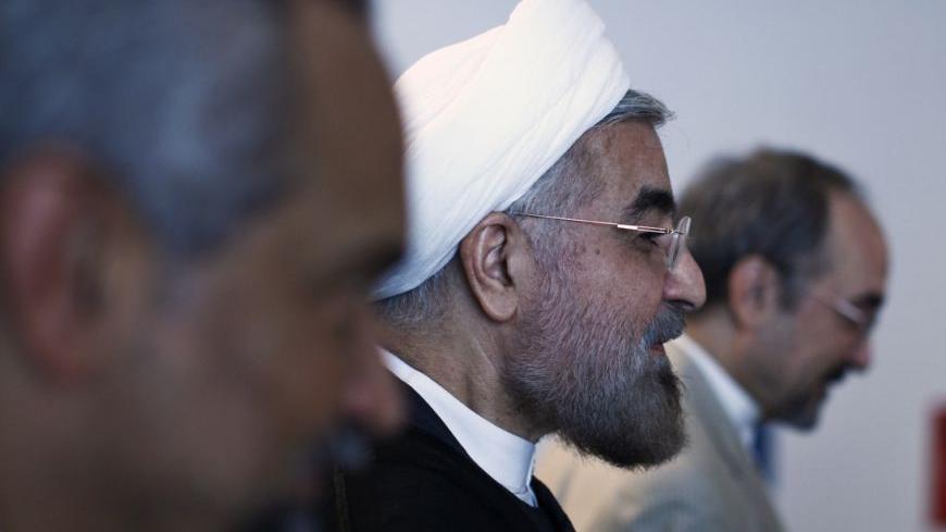 Iran's President Hassan Rohani (C) walks next to delegate members after speaking in a High-Level Meeting on Nuclear Disarmament during the 68th United Nations General Assembly at U.N. headquarters in New York, September 26, 2013. REUTERS/Eduardo Munoz (UNITED STATES - Tags: POLITICS) - RTX140O5