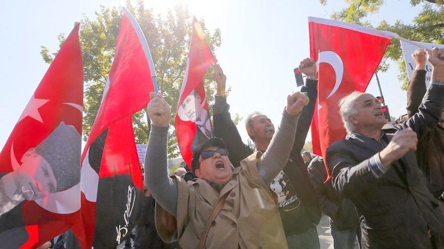Relatives of detained military officers shout slogans in front of the Chief of Staff Headquarters in Ankara October 9, 2013. Turkey's appeals court upheld convictions on Wednesday of top retired military officers for leading a plot to overthrow Prime Minister Tayyip Erdogan's government a decade ago in a case underlining civilian dominance over a once all-powerful army. The court overturned convictions of dozens of less prominent defendants among more than 300 officers sentenced last September in the "Sledg