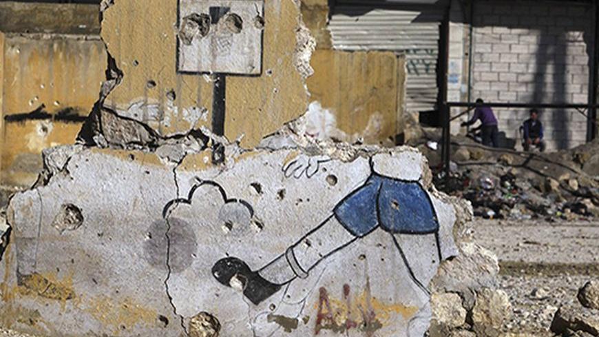 A view shows a damaged wall at a school in Aleppo January 15, 2013. REUTERS/Muzaffar Salman  (SYRIA - Tags: POLITICS CIVIL UNREST) - RTR3CHJL