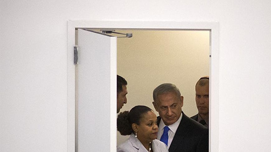 Israel's Prime Minister Benjamin Netanyahu enters a door to speak at the 68th session of the United Nations General Assembly in New York October 1, 2013. Netanyahu said on Tuesday the only way to peacefully stop Iran from developing nuclear weapons is to combine tough sanctions with a credible military threat and that Israel was ready to stand alone in defending itself. REUTERS/Adrees Latif (UNITED STATES - Tags: POLITICS) - RTR3FHFO