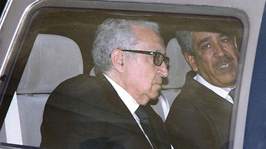 United Nations Peace Envoy for Syria Lakhdar Brahimi (L) sits in a car as he leaves a hotel in Damascus October 28, 2013.  REUTERS/Khaled al-Hariri (SYRIA - Tags: POLITICS CONFLICT CIVIL UNREST) - RTX14RFN