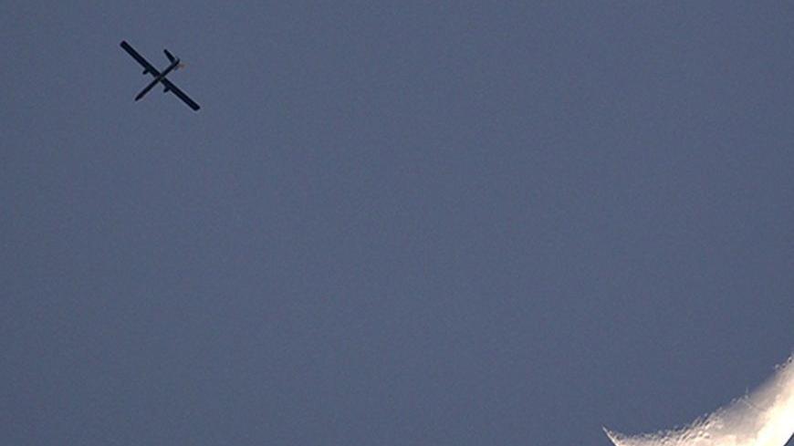 An Israeli air force drone is seen flying over Gaza as seen from the northern Gaza strip border April 9, 2011. Israel killed four Palestinian militants and wounded half a dozen others as it pursued air raids in Gaza for a third day on Saturday, responding to increased rocket fire out of the territory, local medics said.
REUTERS/Darren Whiteside (ISRAEL - Tags: MILITARY SOCIETY IMAGES OF THE DAY) - RTR2L11O
