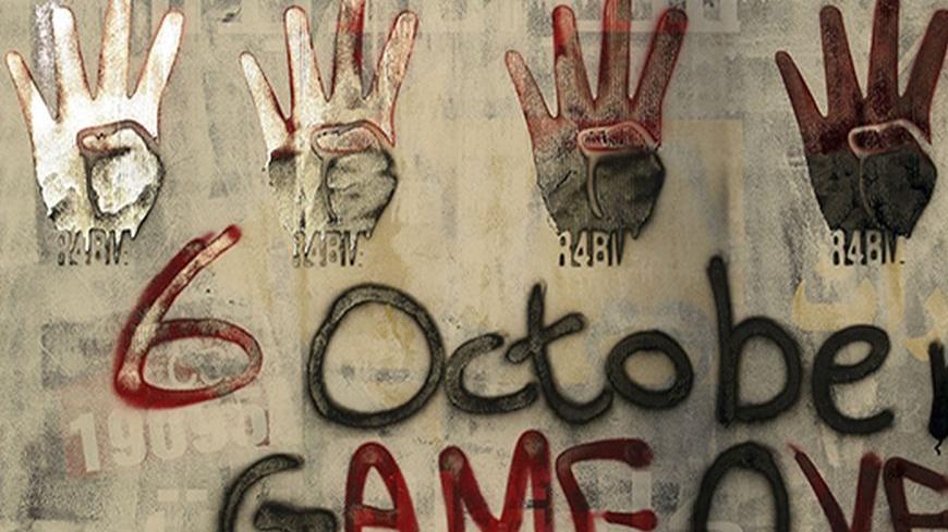 Signs of the "Rabaa" or "four" are seen during a protest against the military by members of the Muslim Brotherhood and supporters of ousted Egyptian President Mohamed Mursi near Rabaa al-Adaweya square in Cairo, October 4, 2013. Five people were killed in clashes on Friday as supporters of deposed President Mohamed Mursi took to the streets of Cairo and other cities to demand the end of army-backed rule. The marches were the most ambitious attempt by the Muslim Brotherhood to press its demands since August 