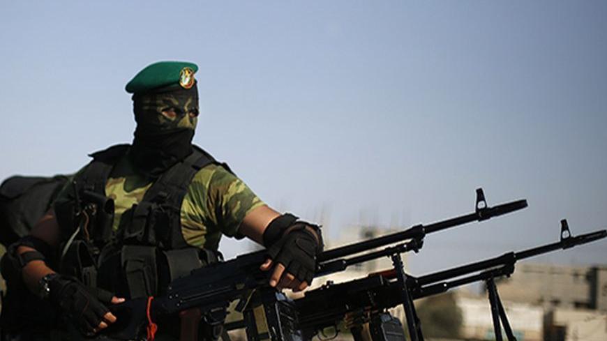A Palestinian Hamas militant takes part in a protest against peace talks between Israel and the Palestinians, in Gaza City September 14, 2013. REUTERS/Suhaib Salem (GAZA - Tags: POLITICS CIVIL UNREST) - RTX13LA6