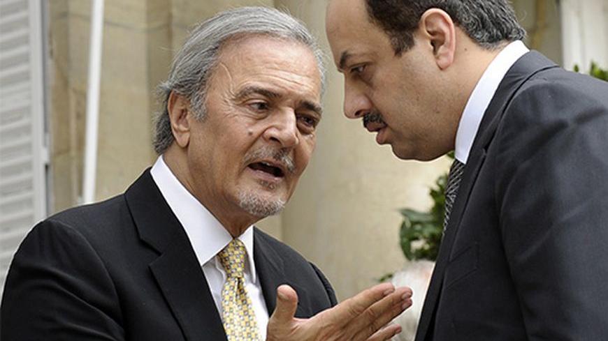 Saudi Foreign Minister Saud al Faisal (L) talks with Qatar Foreign Minister Khalid Al Attiya following their meeting with U.S. Secretary of State John Kerry and members of the Arab Peace Initiative at the United States Embassy in Paris, September 8, 2013. REUTERS/Susan Walsh/Pool (FRANCE - Tags: POLITICS) - RTX13CWG