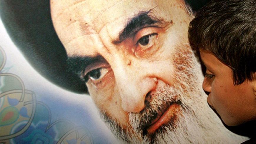 An Iraqi Shi'ite Muslim boy kisses a poster of the Ayatollah Ali al-Sistani in the town of Karbala, some 110 km south from the Iraqi capital Baghdad, early February 6, 2004. Iraq's most powerful Shi'ite cleric, Ayatollah Ali al-Sistani, survived an assassination bid on Thursday when gunmen opened fire on his entourage in the sacred streets of Najaf, a security aide said. The assassination attempt comes days before a team of United Nations electoral experts is due to arrive in the country to assess the feasi