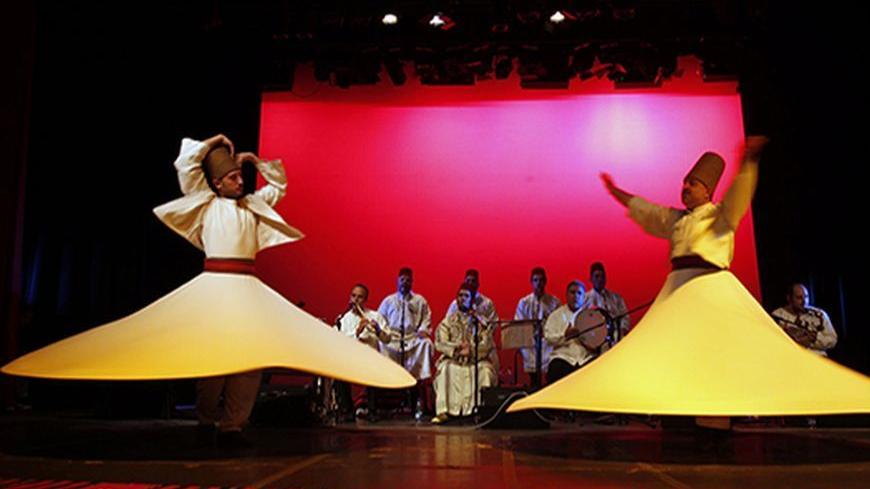 Syria's Sufi Tahleela Band performs during the third annual Sufi Festival at the Royal Cultural Center in Amman October 12, 2010. Arab and international Sufi groups are taking part in the one week event. REUTERS/Ali Jarekji (JORDAN - Tags: ENTERTAINMENT SOCIETY) - RTXTCZH