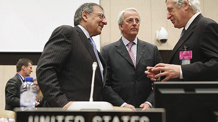U.S. Secretary of Defense Leon Panetta (L) speaks with U.S. Ambassador to the North Atlantic Treaty Organization Ivo Daalder (C) and European Union Secretary-General of the European External Action Service Pierre Vimont before a NATO Defense Ministers meeting with non-NATO International Security Assistance Force (ISAF) contributing nations at NATO headquarters in Brussels February 22, 2013. Panetta is attending meetings and holding bilateral meetings with other NATO defense officials. REUTERS/Chip Somodevil