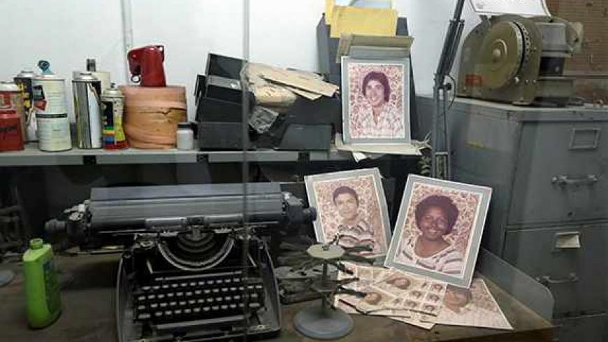 Equipments and photographs that belonged to American diplomatic staff are displayed at the former US embassy now turned into a museum in Tehran on November 2, 2013. November 4 is the 34th anniversary of the seizure of the US embassy in Tehran, during which Islamist students captured and held 52 US diplomats hostage for 444 days. The crisis triggered a cut in diplomatic relations and led to decades of mutual hostility. AFP PHOTO/ATTA KENARE        (Photo credit should read ATTA KENARE/AFP/Getty Images)