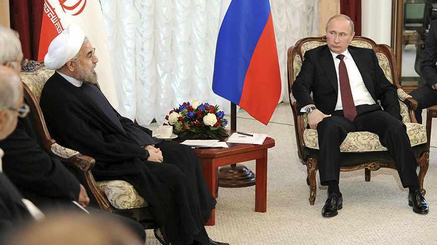 Russia's President Vladimir Putin (R) meets with his Iranian counterpart Hassan Rouhani during the Shanghai Cooperation Organization (SCO) summit in Bishkek, September 13, 2013. Rouhani said on Friday that he wanted a swift resolution to a dispute over Tehran's nuclear programme, which Western states fear is aimed at developing nuclear weapons. REUTERS/Mikhail Klimentyev/RIA Novosti/Kremlin (KYRGYZSTAN - Tags: POLITICS) ATTENTION EDITORS - THIS IMAGE HAS BEEN SUPPLIED BY A THIRD PARTY. IT IS DISTRIBUTED, E