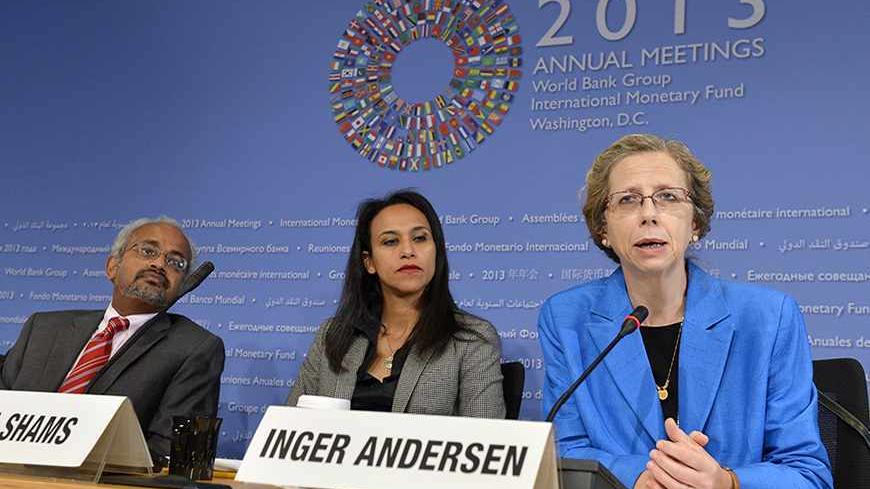 Inger Andersen, (R), the World Bank's Vice President for the Middle East and North Africa (MENA) region, makes remarks as Shanta Devarajan, (L), the World Bank's chief economist for MENA and communications manager Heba Shams listen, as she discusses political turmoil and economics in the region at a news conference during the IMF and World Bank's 2013 Annual Fall Meetings, in Washington, October 10, 2013. The meetings come at a time of economic uncertainty with the world's nations possibly slipping back int