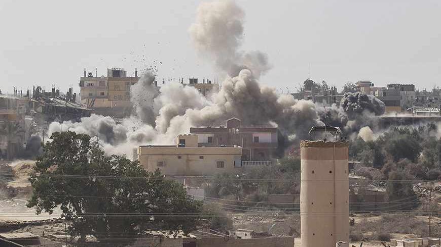 Smoke rises during a military operation by Egyptian security forces in the Egyptian city of Rafah, near the border with southern Gaza Strip October 13, 2013. REUTERS/Ahmed Zakot (EGYPT - Tags: POLITICS MILITARY) - RTX149QW