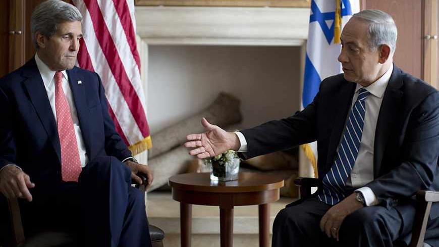Israel's Prime Minister Benjamin Netanyahu reaches out to shake hands with U.S. Secretary of State John Kerry in Jerusalem November 6, 2013. REUTERS/Jason Reed (JERUSALEM - Tags: POLITICS) - RTX151ZB