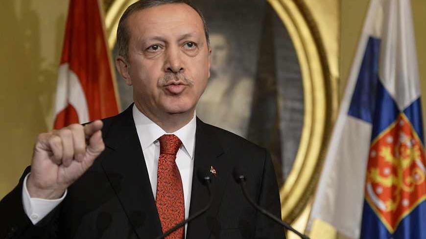 Turkey's Prime Minister Tayyip Erdogan addresses reporters during a news conference at the Government Banquet Hall in Helsinki, November 6, 2013. REUTERS/Jussi Nukari/Lehtikuva (FINLAND - Tags: POLITICS) ATTENTION EDITORS - THIS IMAGE HAS BEEN SUPPLIED BY A THIRD PARTY. IT IS DISTRIBUTED, EXACTLY AS RECEIVED BY REUTERS, AS A SERVICE TO CLIENTS. NO THIRD PARTY SALES. NOT FOR USE BY REUTERS THIRD PARTY DISTRIBUTORS. FINLAND OUT. NO COMMERCIAL OR EDITORIAL SALES IN FINLAND - RTX152FG