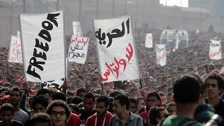 Al Ahli fans take part in a protest march in front of the general prosecutor's office in Cairo November 6, 2013. The protesters were calling for the release of their fellow fans, who were arrested earlier last month during clashes with security personnel as the club's handball team returned from Morocco after winning silver in the African Champions League handball tournament.  REUTERS/Mohamed Abd El Ghany (EGYPT - Tags: SPORT HANDBALL CIVIL UNREST) - RTX152G1