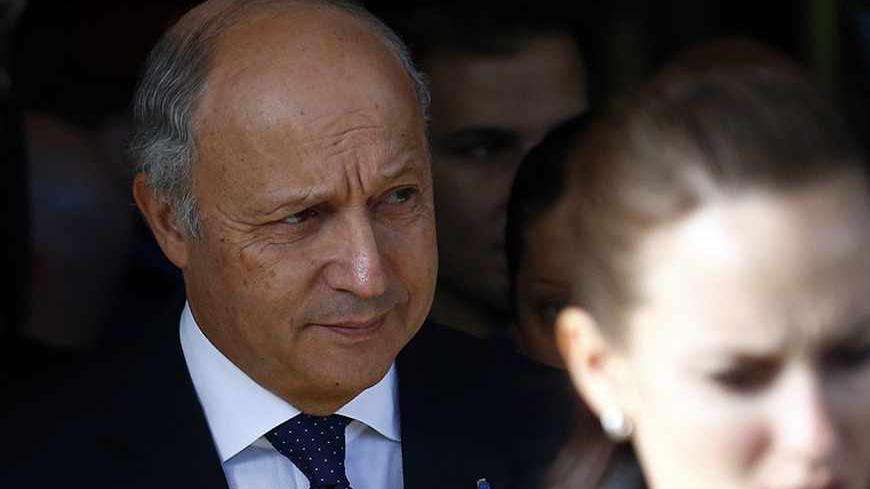 French Foreign Minister Laurent Fabius leaves the Intercontinental hotel on the third day of closed-door nuclear talks with Iran in Geneva November 9, 2013. REUTERS/Denis Balibouse (SWITZERLAND - Tags: POLITICS ENERGY HEADSHOT) - RTX156G4